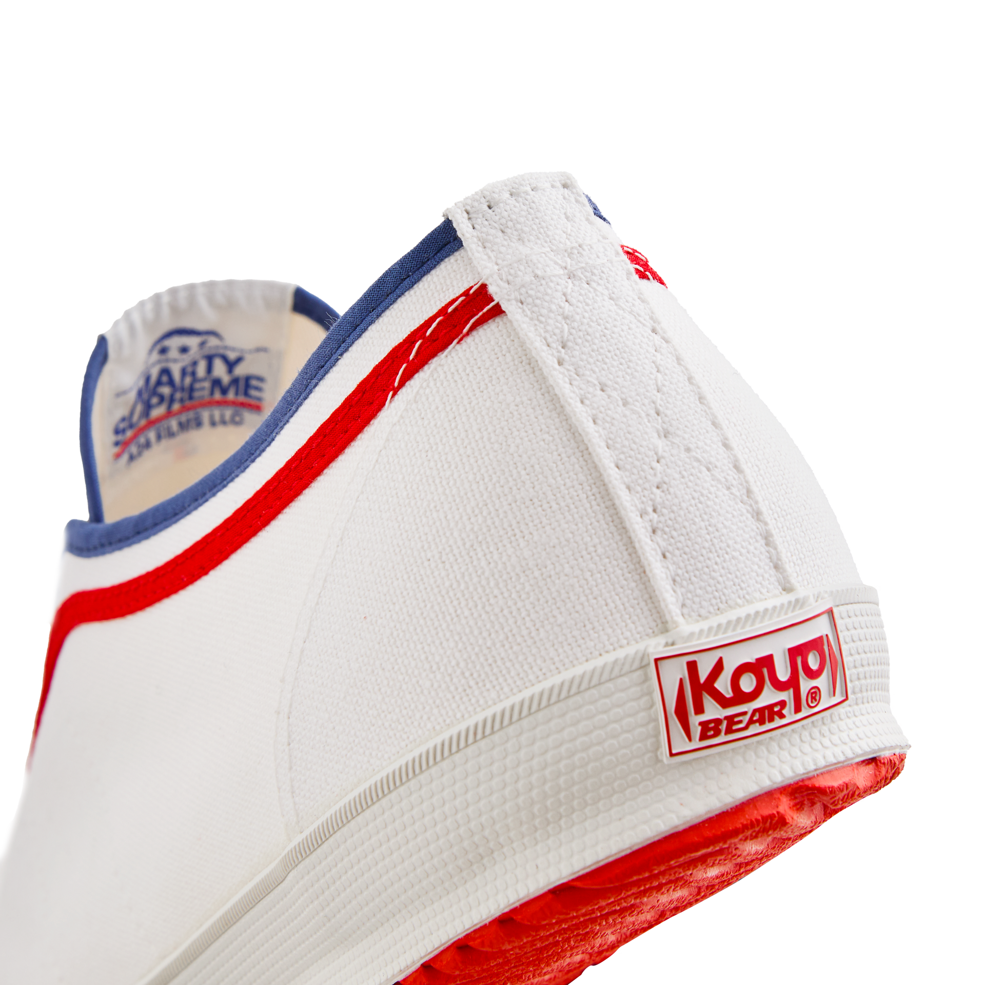 Side back view of the white Koyo Bear Sharpman Marty Supreme sneakers with red and blue trim, showing the heel patch and rear logo.
