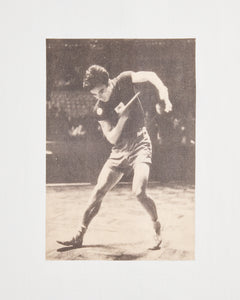 Front print of the Koyo Bear Ichiro Ogimura OGI Signature Serve T-shirt showing a vintage action photograph of the Japanese table tennis legend during a serve.