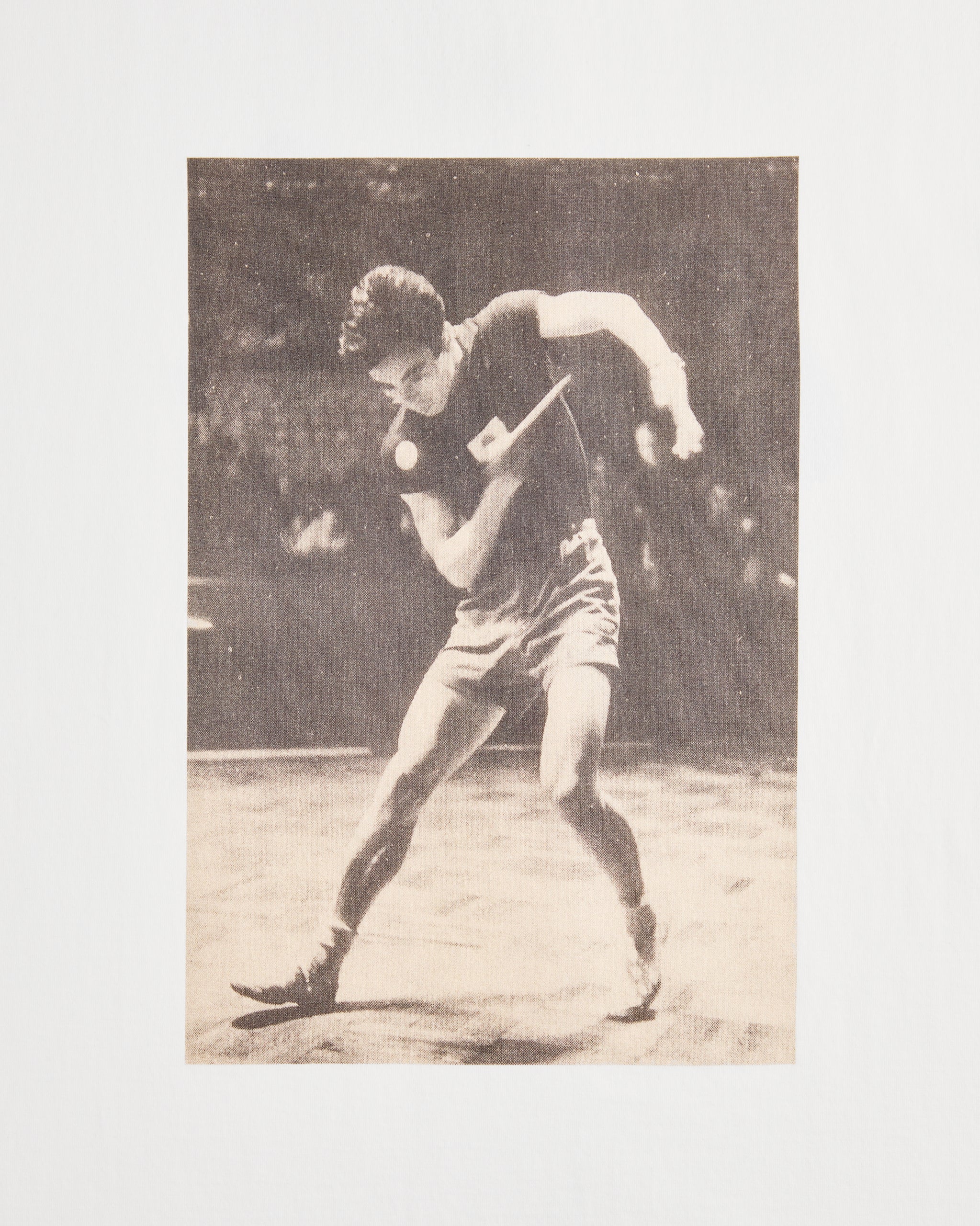 Front print of the Koyo Bear Ichiro Ogimura OGI Signature Serve T-shirt showing a vintage action photograph of the Japanese table tennis legend during a serve.