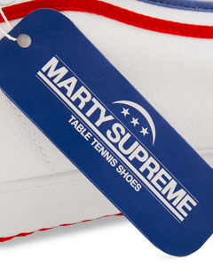 Blue collaboration hangtag from the Koyo Bear x Marty Supreme release, highlighting the limited-edition Made in Japan craftsmanship and heritage performance design.