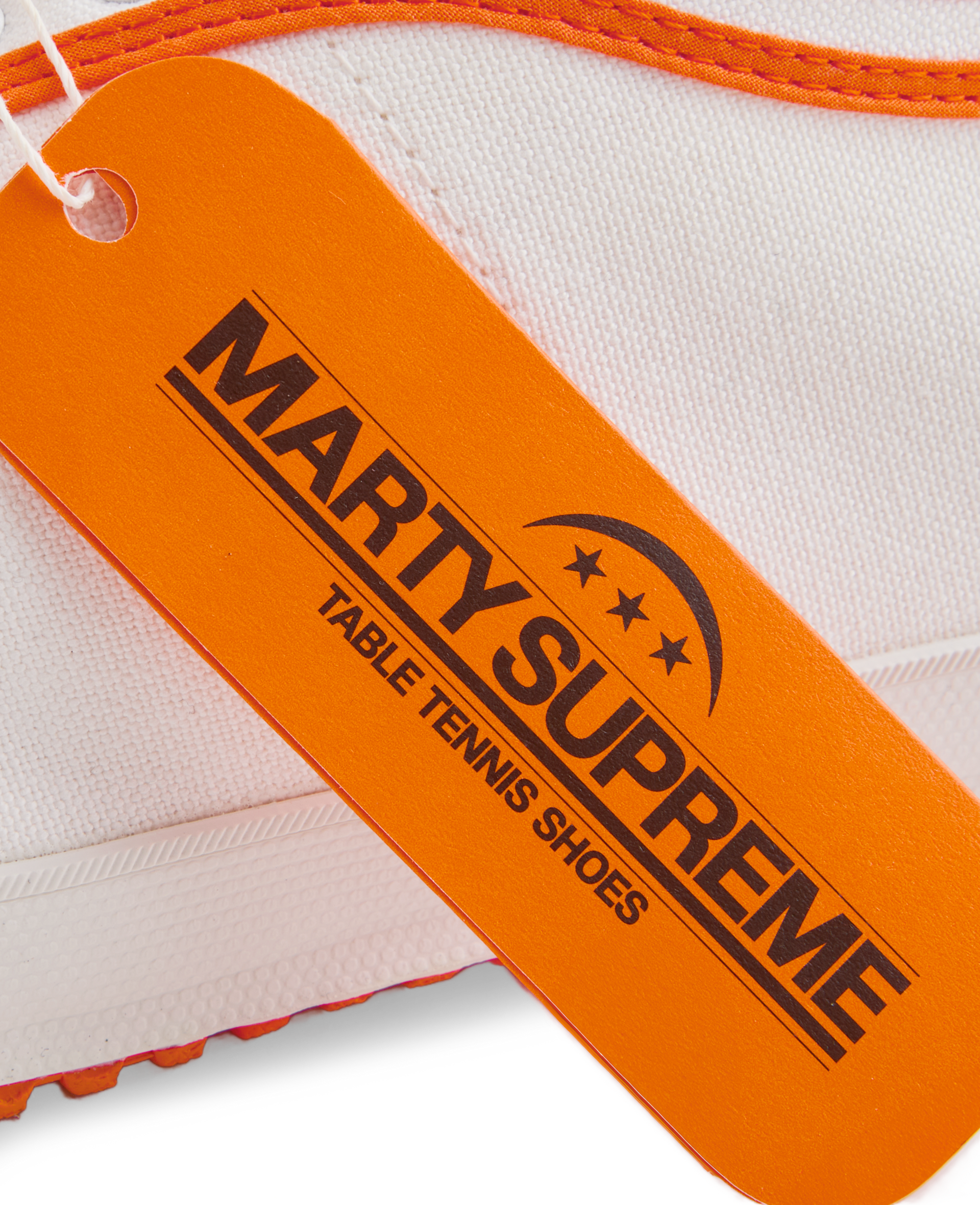 Orange collaboration hangtag from the Koyo Bear x Marty Supreme release, highlighting the limited-edition Made in Japan craftsmanship and heritage performance design.