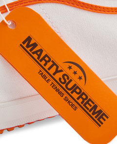 Orange collaboration hangtag from the Koyo Bear x Marty Supreme release, highlighting the limited-edition Made in Japan craftsmanship and heritage performance design.