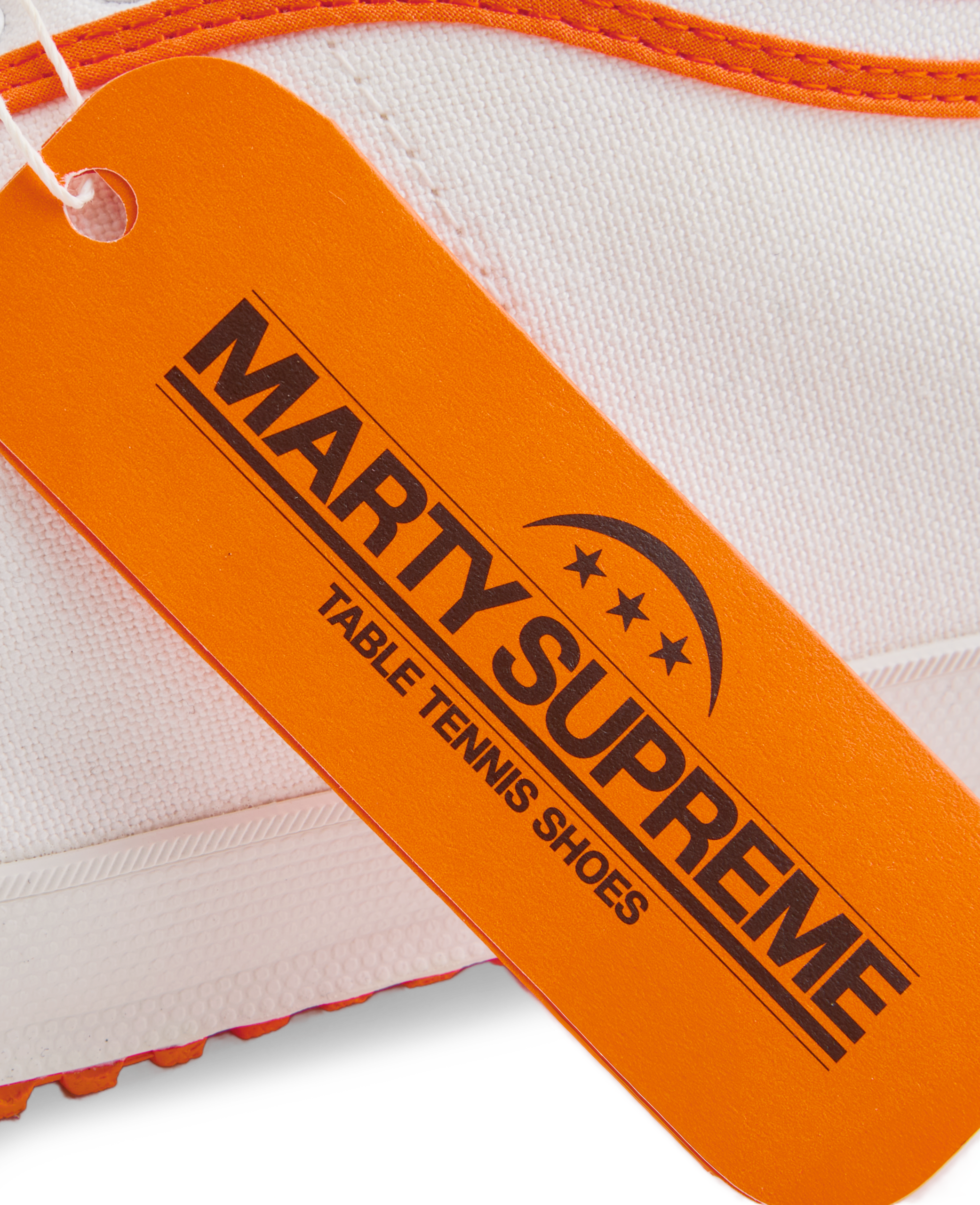Orange collaboration hangtag from the Koyo Bear x Marty Supreme release, highlighting the limited-edition Made in Japan craftsmanship and heritage performance design.
