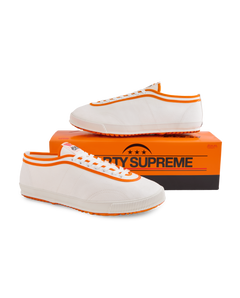 Koyo Bear x Marty Supreme Sharpman sneakers with orange trim and vulcanized sole, handmade in Japan and displayed with limited-edition Marty Supreme shoebox packaging.