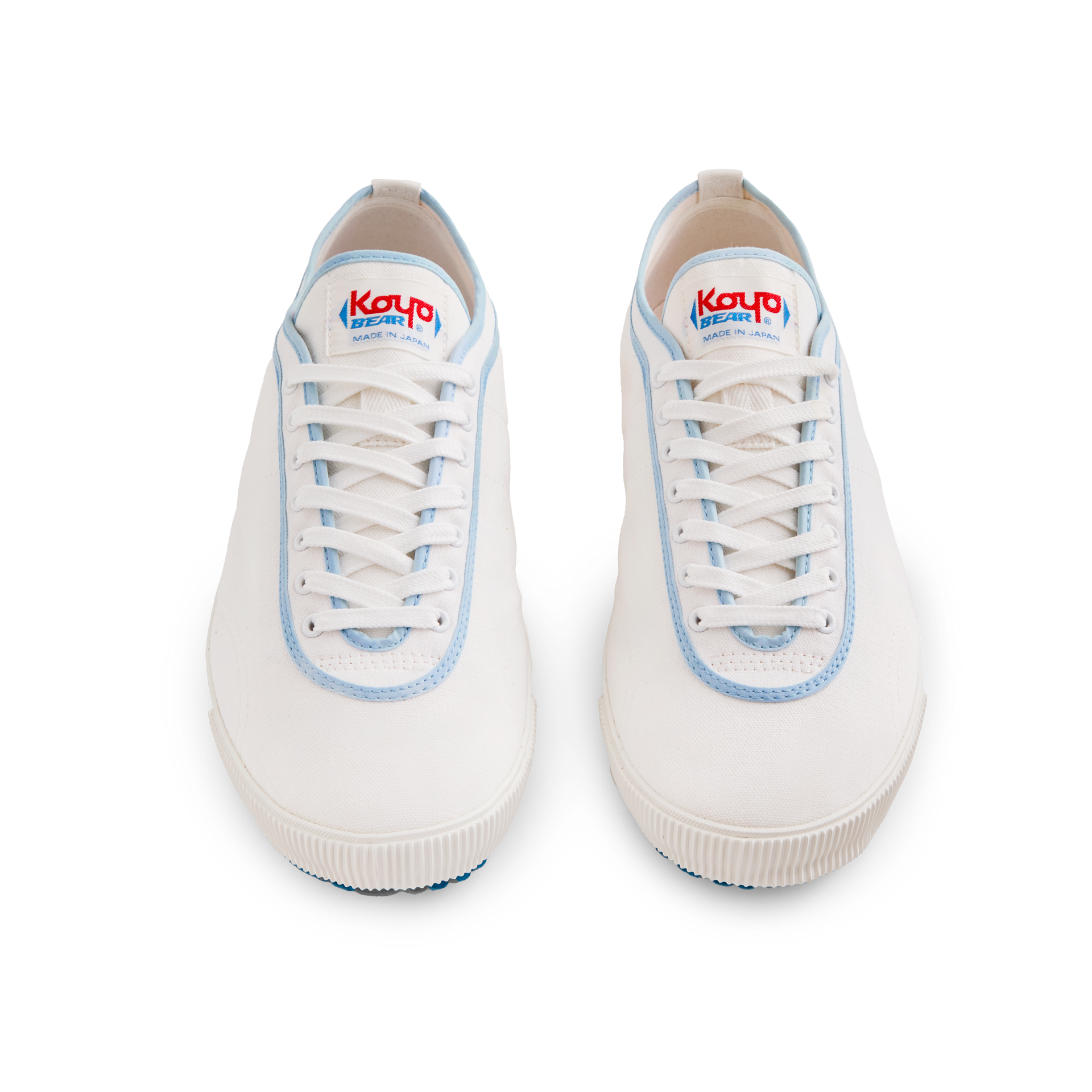 Front view of the handmade Koyo Bear Sharpman Blue Trim canvas sneakers, made in Japan in white canvas with light blue piping, shown as a matching pair with the classic low-profile table tennis design.