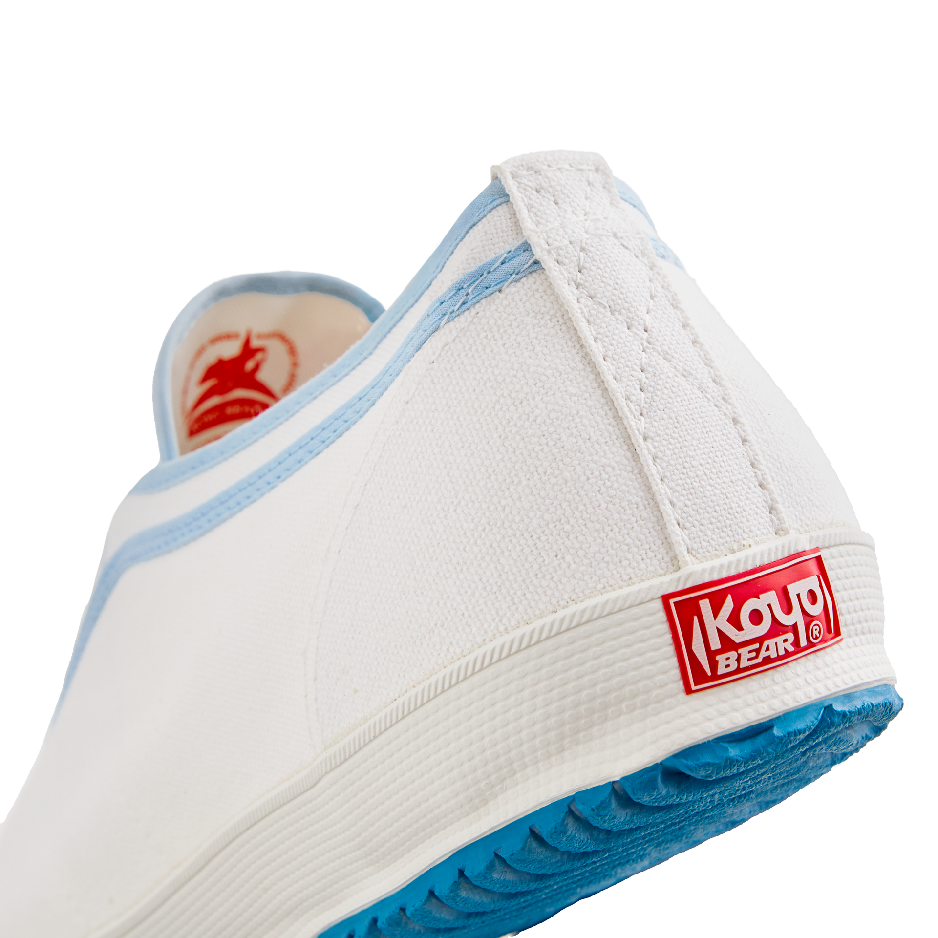 Back view of the handmade Koyo Bear Sharpman Blue Trim canvas sneakers, made in Japan in white canvas with light blue piping, showing the Koyo Bear heel logo and blue vulcanised rubber sole.