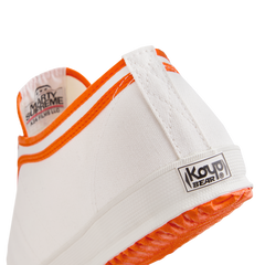 Side back view of the orange version Koyo Bear Sharpman Marty Supreme sneakers with red and blue trim, showing the heel patch and rear logo.