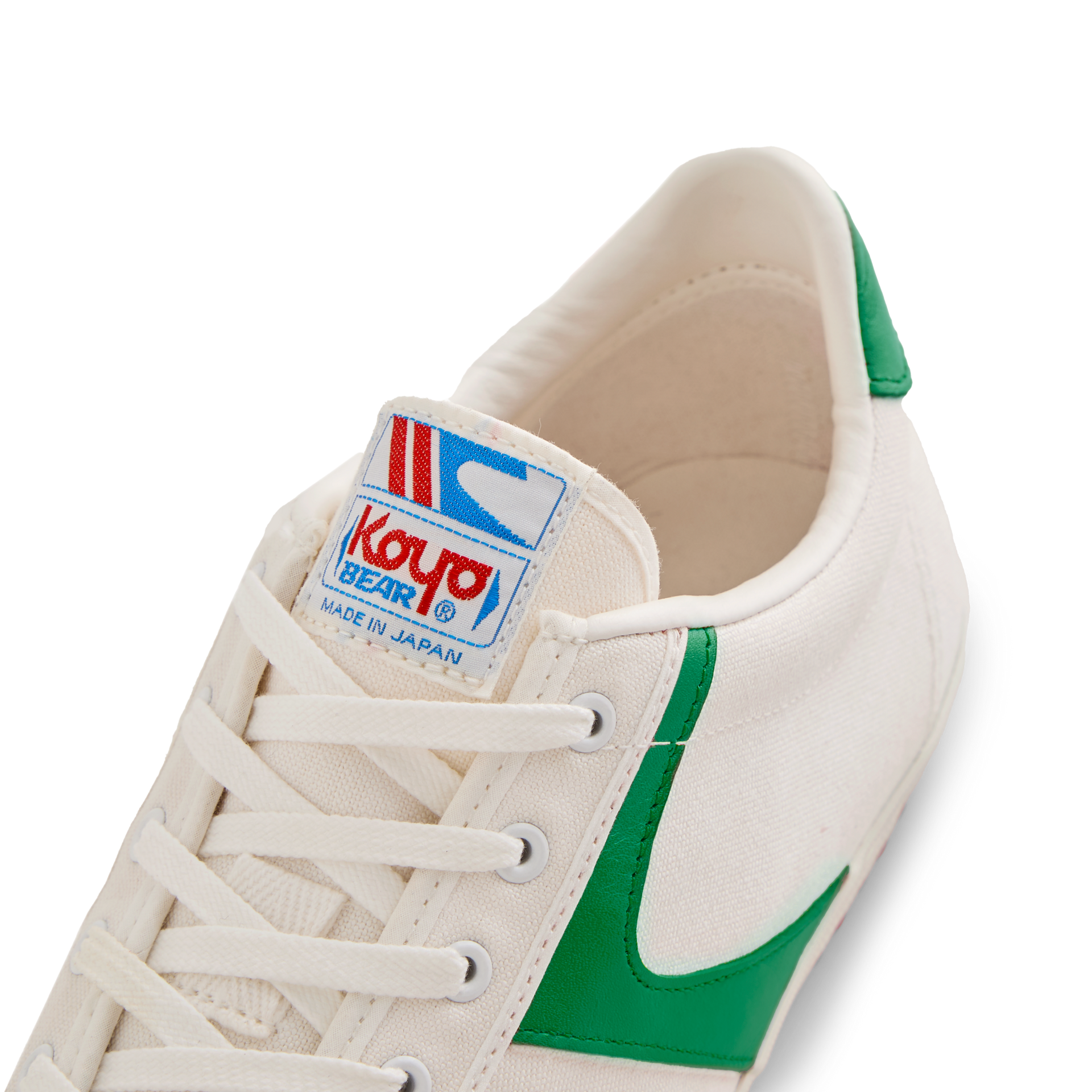 Close-up of the tongue label on the Koyo Bear Sharpman Nimble Green sneakers showing the Koyo Bear logo and Made in Japan branding.