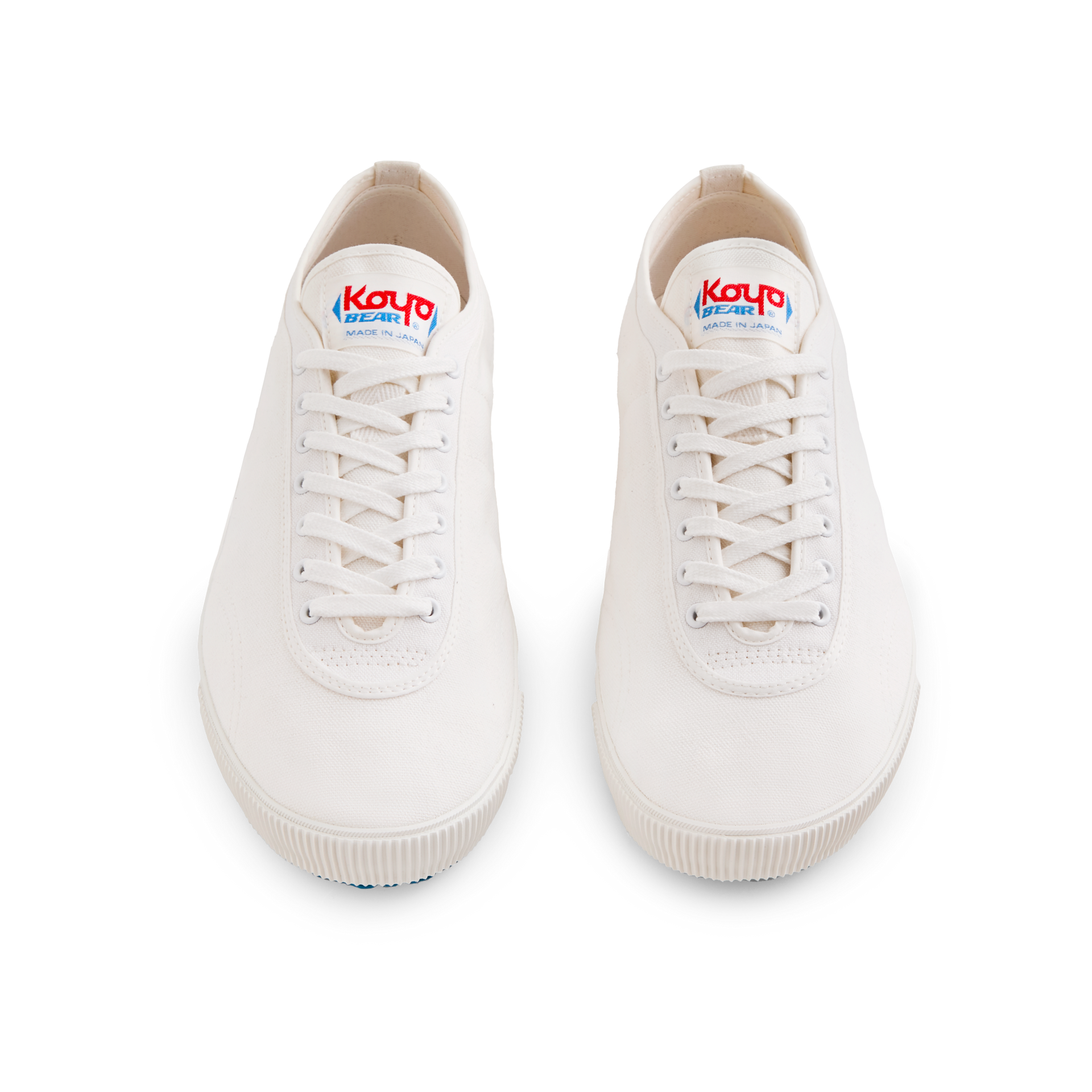 Front view of the handmade Koyo Bear Sharpman White Trim canvas sneakers, made in Japan, shown as a matching pair of the world’s first purpose-built table tennis shoe.