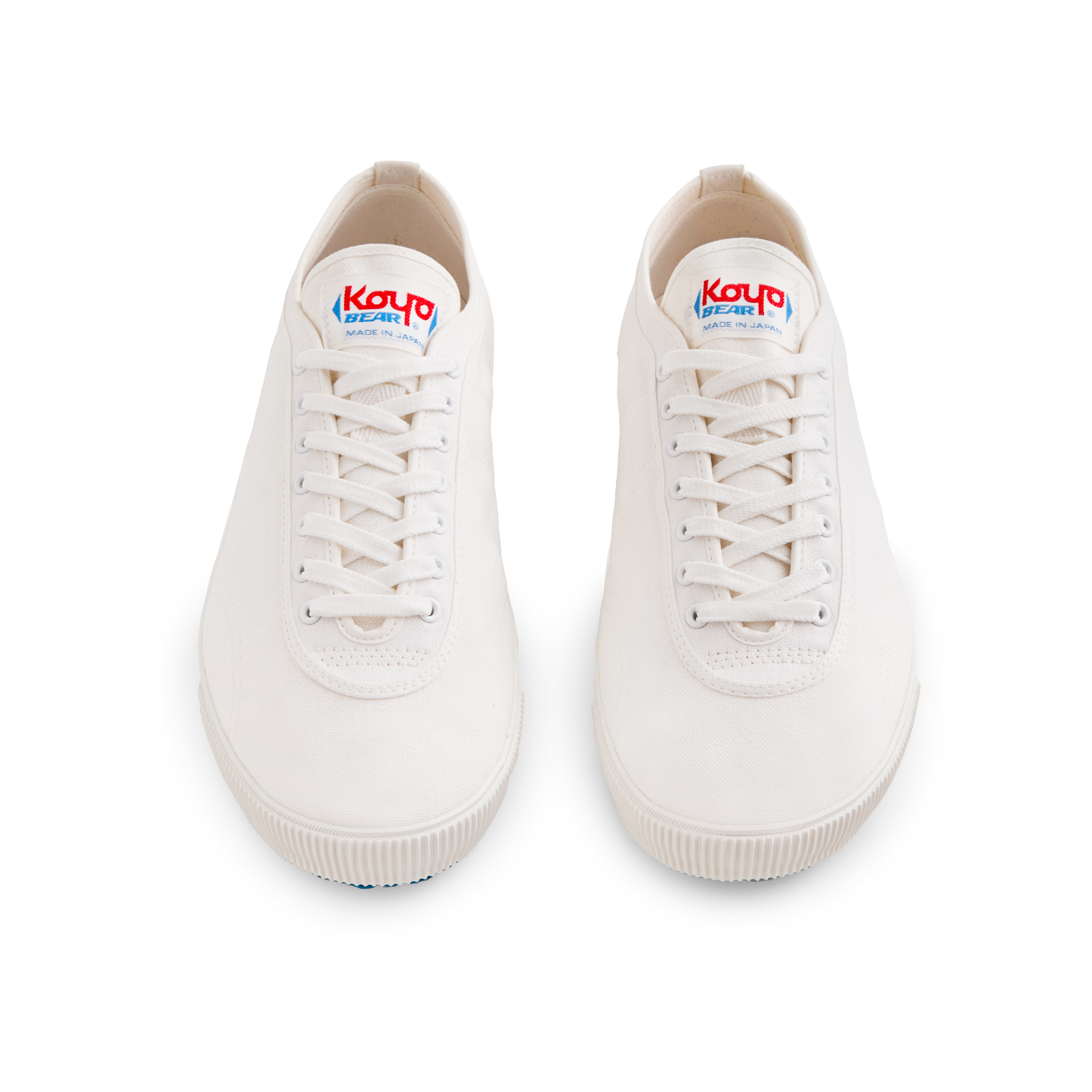 Front view of the handmade Koyo Bear Sharpman White Trim canvas sneakers, made in Japan, shown as a matching pair of the world’s first purpose-built table tennis shoe.