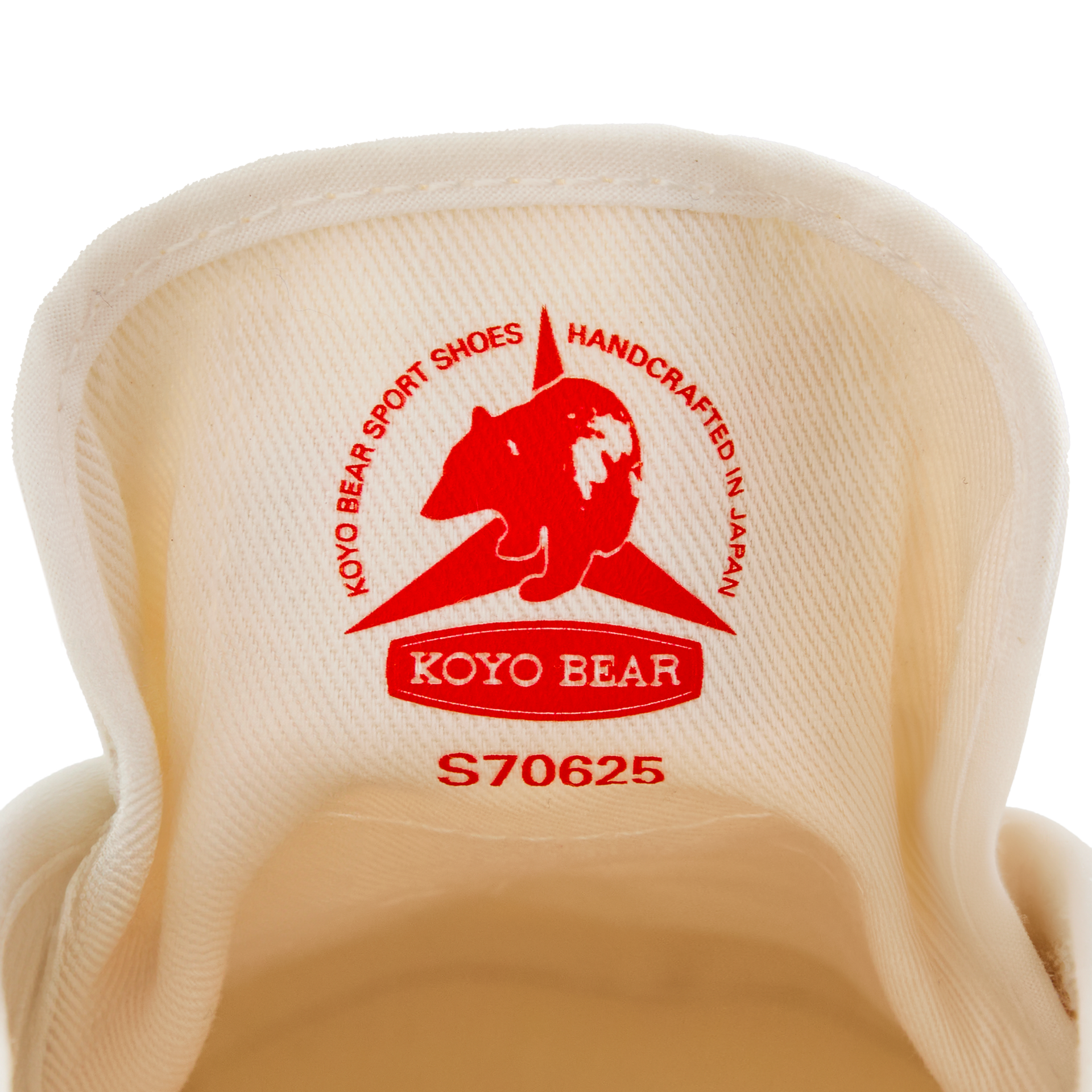 Close-up of the inner tongue label on the handmade Koyo Bear Sharpman White Trim canvas sneakers, made in Japan, showing the Koyo Bear logo and “Handcrafted in Japan” stamp of the original table tennis shoe.