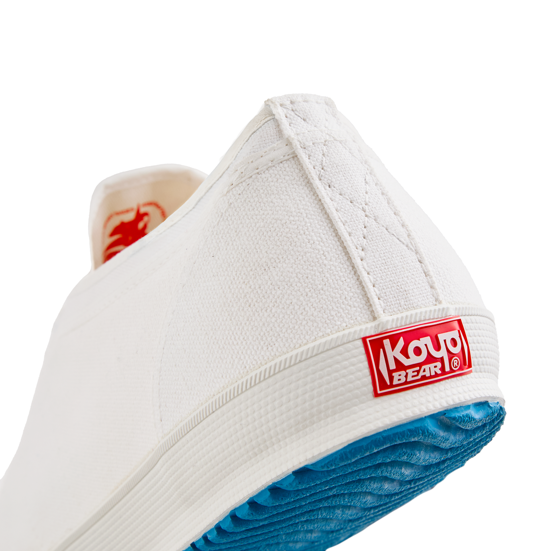Back view of the handmade Koyo Bear Sharpman White Trim canvas sneakers, made in Japan, showing the heel logo and vulcanised rubber sole of the world’s first table tennis shoe.