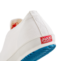 Back view of the handmade Koyo Bear Sharpman White Trim canvas sneakers, made in Japan, showing the heel logo and vulcanised rubber sole of the world’s first table tennis shoe.