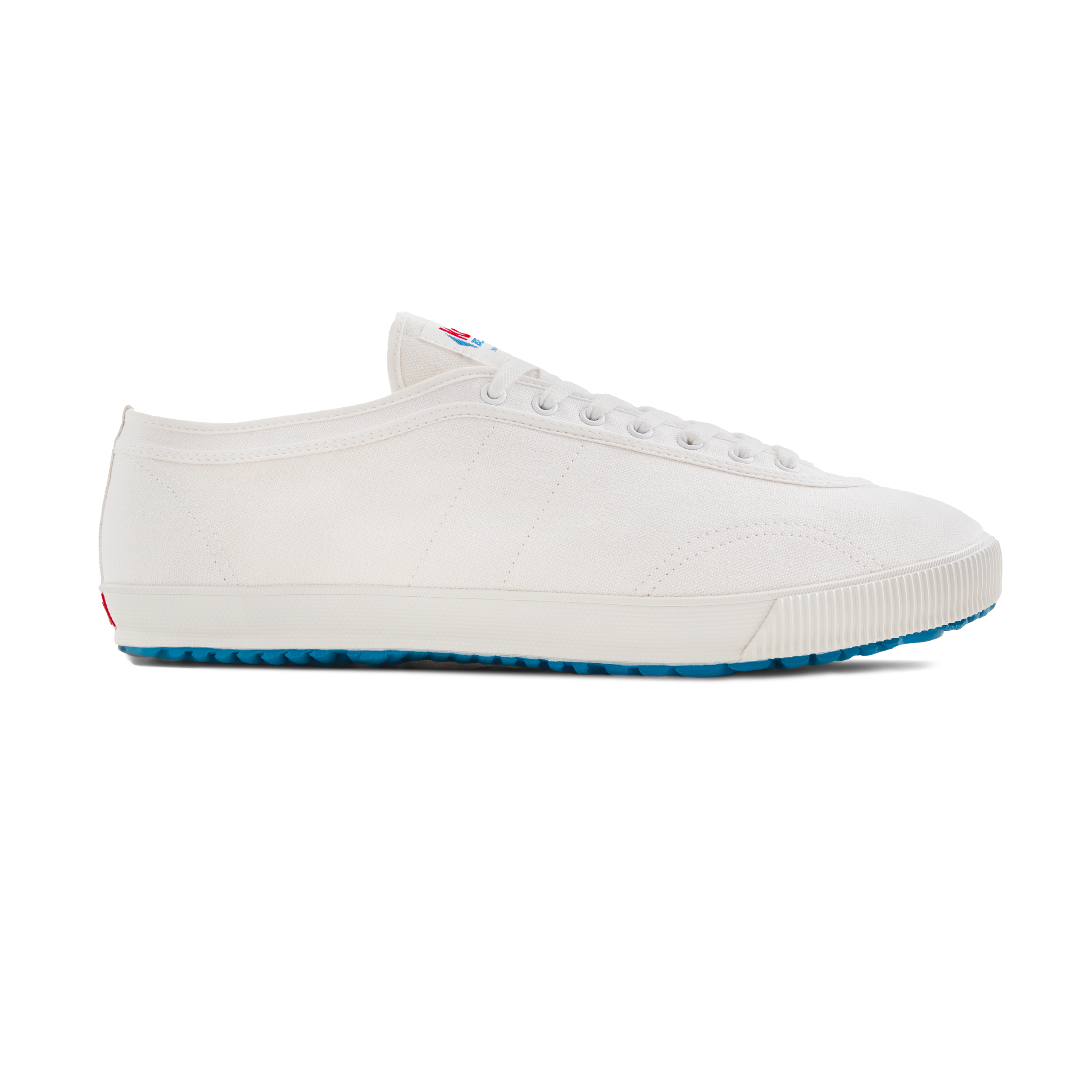Side view of the handmade Koyo Bear Sharpman White Trim canvas sneakers, made in Japan in white canvas with subtle white piping, featuring the timeless silhouette of the original table tennis shoe.