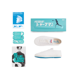 Set view of the handmade Koyo Bear Sharpman White Trim canvas sneakers, made in Japan, including the shoe box, hangtags, postcard, and the book “The Life of Ichiro Ogimura,” celebrating the world’s first purpose-built table tennis shoe.